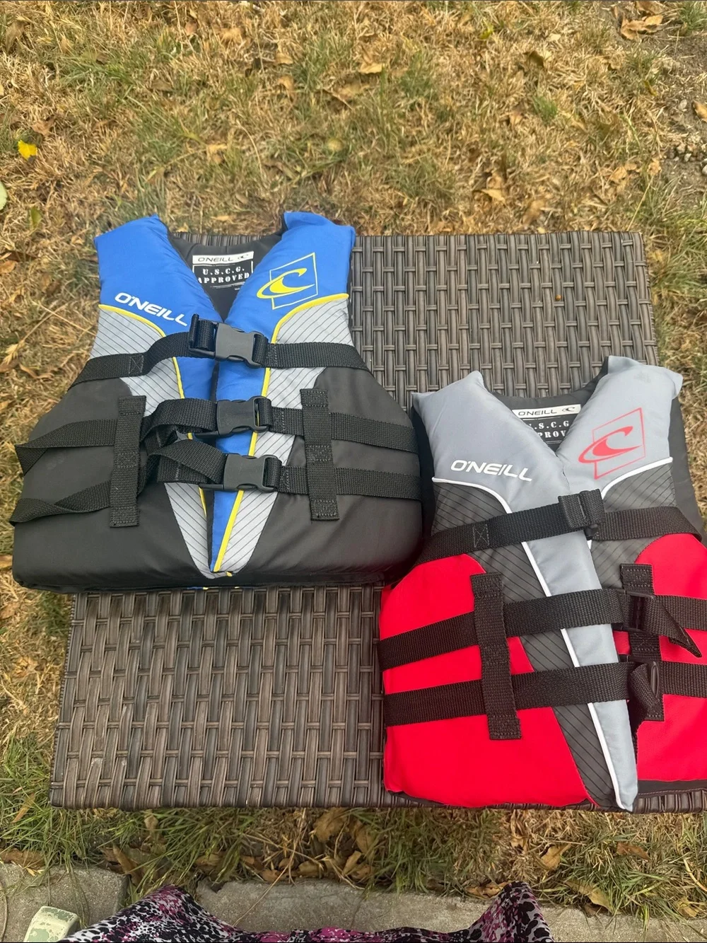 O'Neill Blue/Black and Red/Gray Youth Life Jackets 50 - 90 lbs